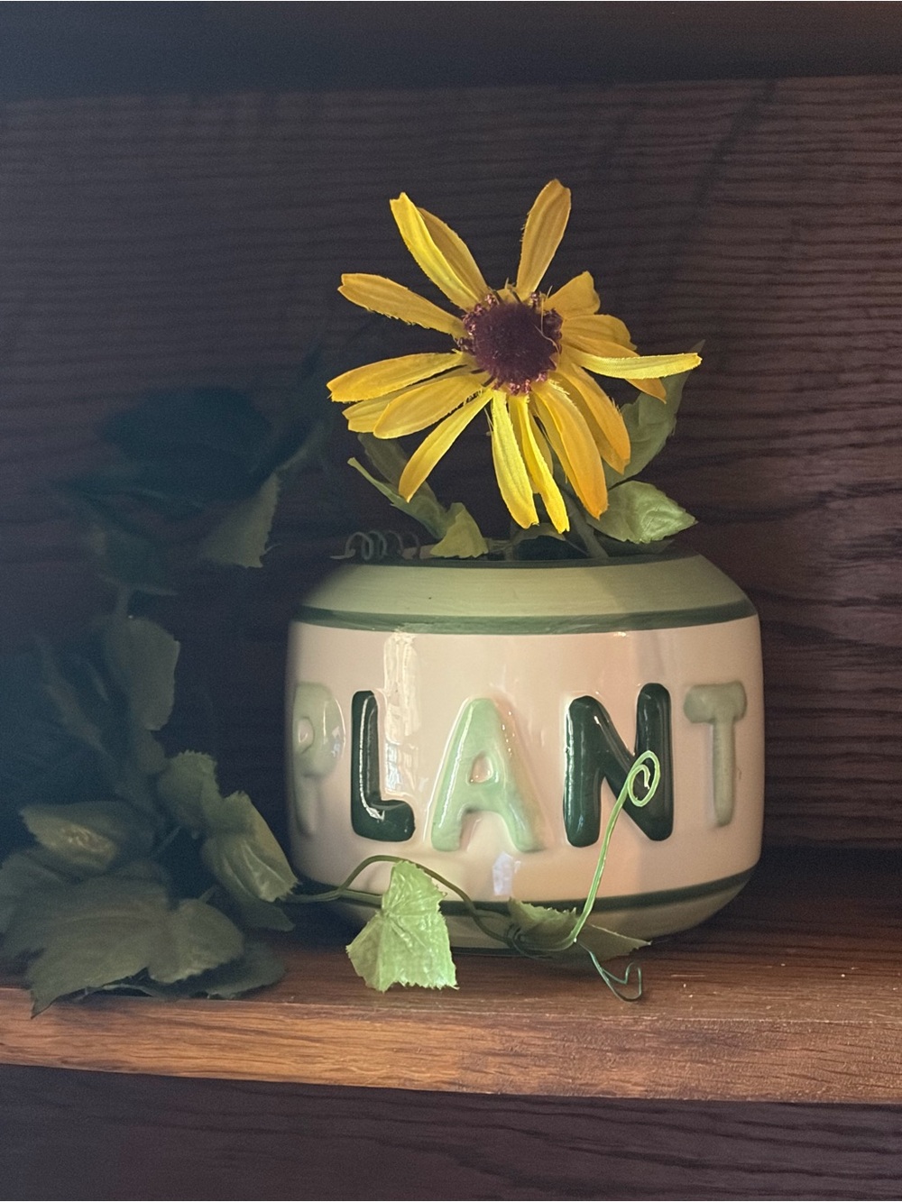 Ceramic Plant Pot with Green Lettering and Yellow Flower Accent